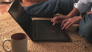 Typing Sound From Laptop Keyboard While Scrolling and Relaxing On Rug, Coffee Nearby, Hands On Keys