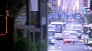 TOKYO, JAPAN, MARCH 1978. Ginza, Chuo Ko Prefecture. Pan Over Busy Shopping Street With Traffic