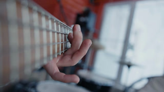 POV Close up of guitarist hand playing on guitar. Close up shot