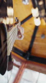 POV Close up of guitarist hand playing on guitar. Close up shot