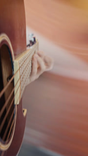 POV Close up of guitarist hand playing on guitar. Close up shot