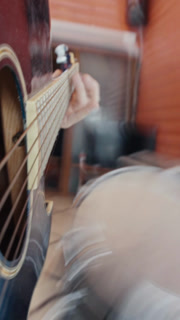 POV Close up of guitarist hand playing on guitar. Close up shot