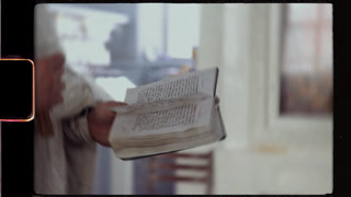 Orthodox priest reading the holy bible during ceremony
