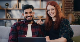Happy couple hugging in beautifully decorated living-room