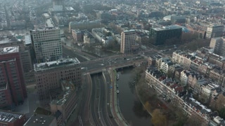 Aerial hyperlapse of the infrastruture intersection in Amsterdam at the Wibautstraat and Mauritskade Rhijnspoorplein. Urban Amsterdam city.