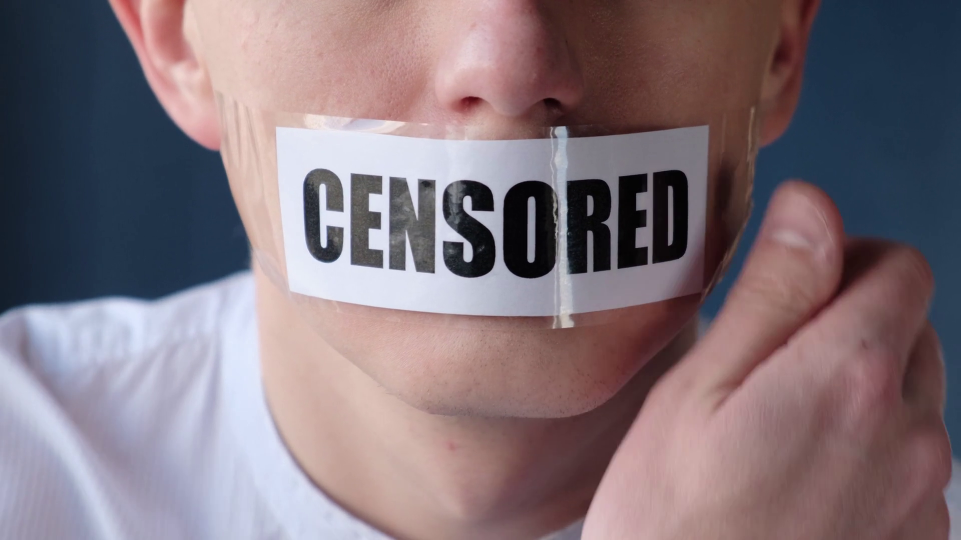 Censorship and prohibitions, freedom of speech concept. Man tearing