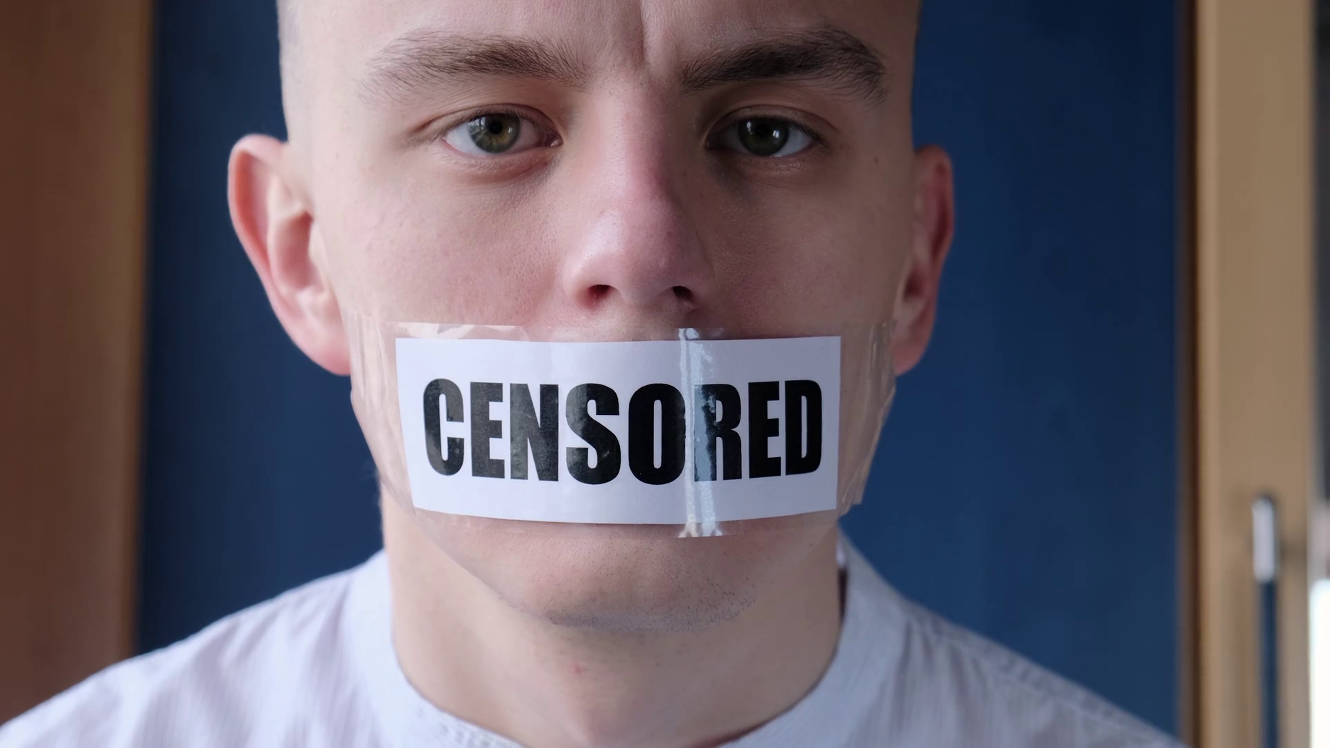 Censorship and prohibitions, freedom of speech concept. Man tearing