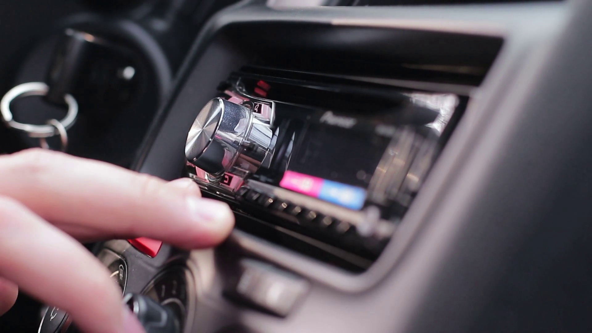 The driver adjusts the volume in the car audio system Stock Video