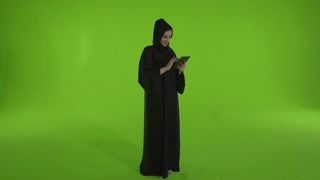 Arab woman using digital tablet.