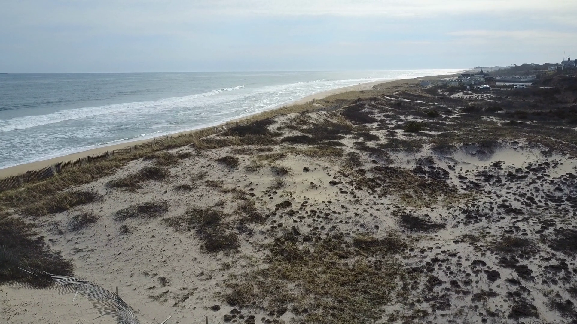 East Hampton Main Beach drone shot above the dunes, waves crashing in