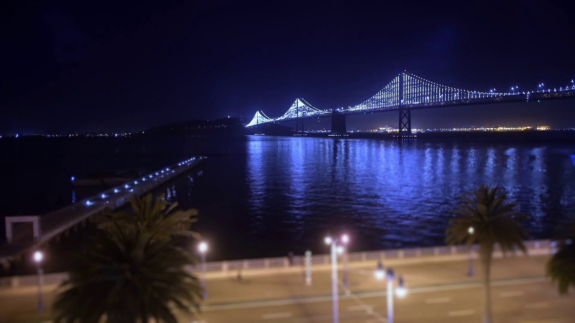 The San FranciscoOakland Bay Bridge is basked in beautiful blue light