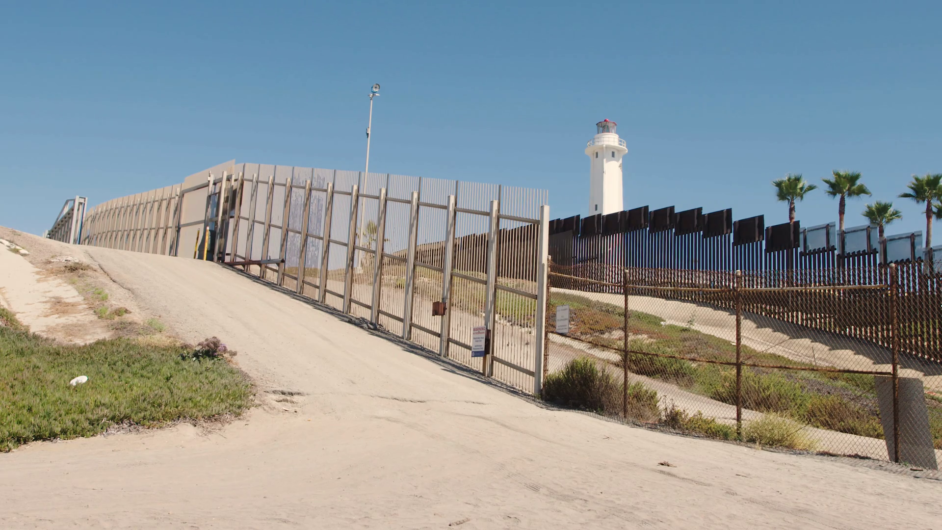 US/Mexico Border Towers guard Border wall separating San Diego & Tijuana Stock Video Footage 00