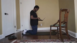 African Man preparing for home workout.