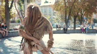 A caveman finds a bustling modern city, showcasing a delightful contrast in lifestyles