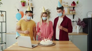 A joyful celebration with friends wearing colorful masks during a lively birthday party event
