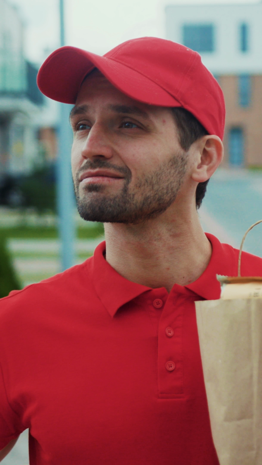 A Delivery Person Wearing Red Uniform Is Stock Footage SBV-353139887 ...