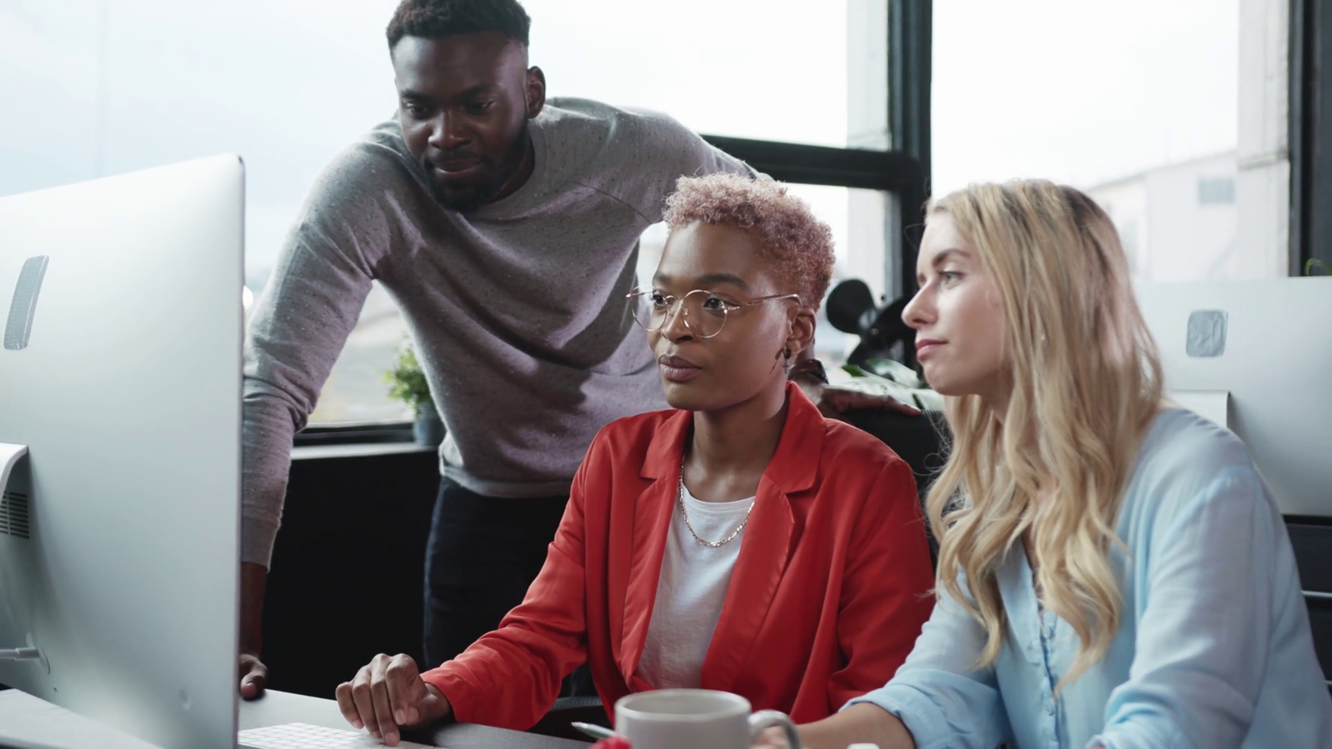 A Diverse Team Collaborates At Desk Stock Footage SBV-351911229 ...