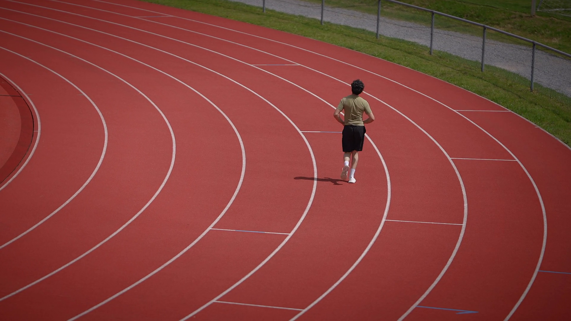 Full Shot Of Young Man Running On Race Track Stock Footage SBV ...