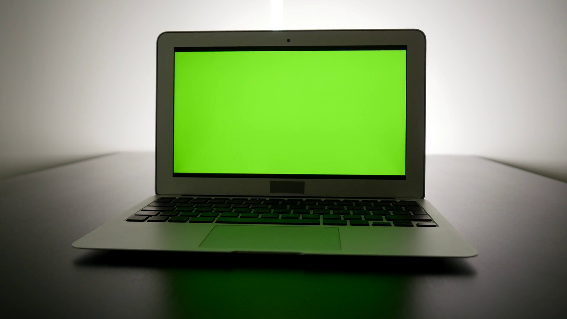 isolated green screen on laptop computer display. modern office desk