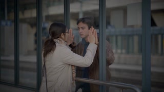 Mother Waving good bye to Son at Train Station 
