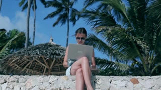 Professional woman working remotely in a beautiful location
