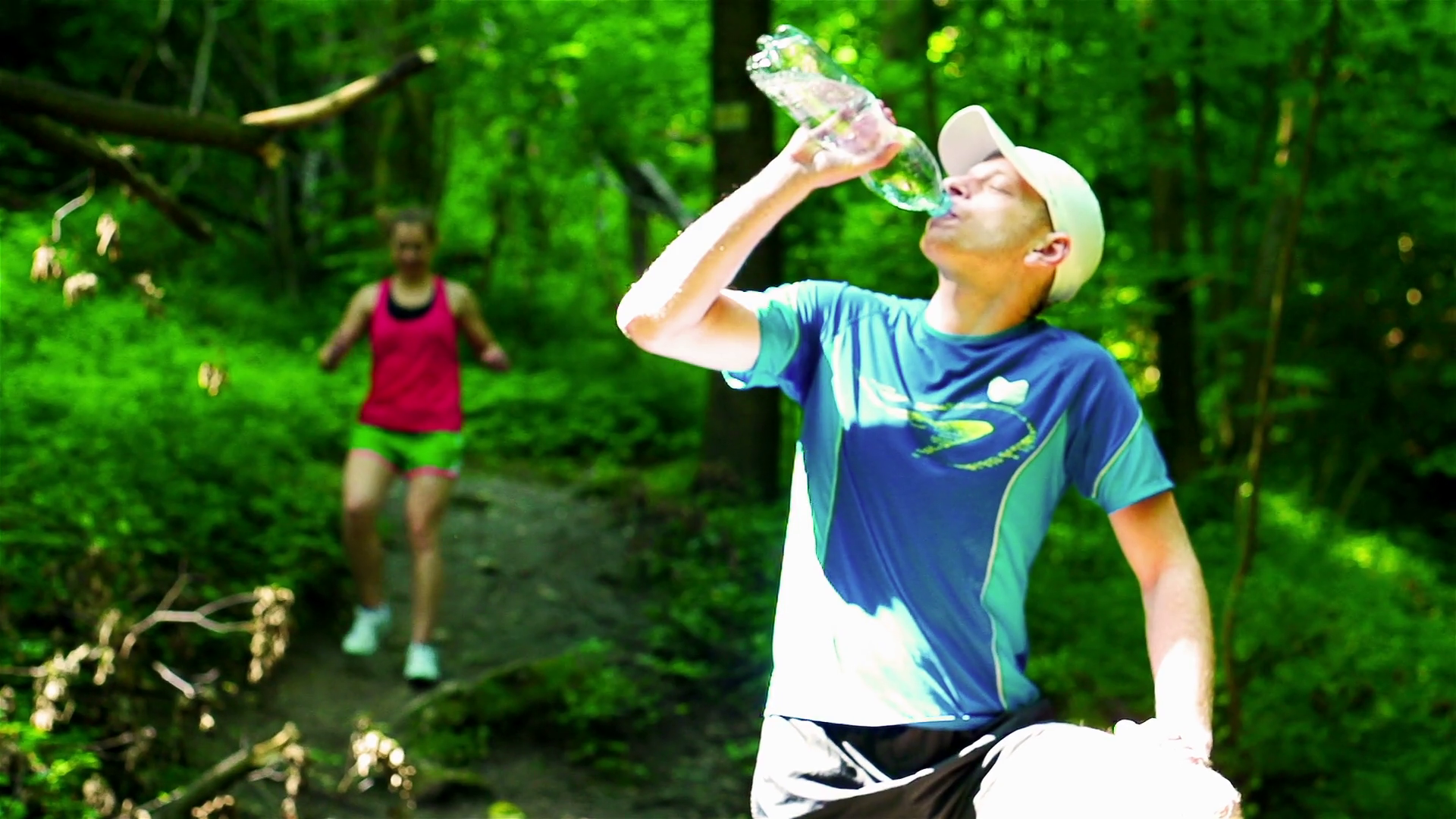 Man drinking water after jogging, steadycam shot, slow motion shot at 240fps Stock Video Footage