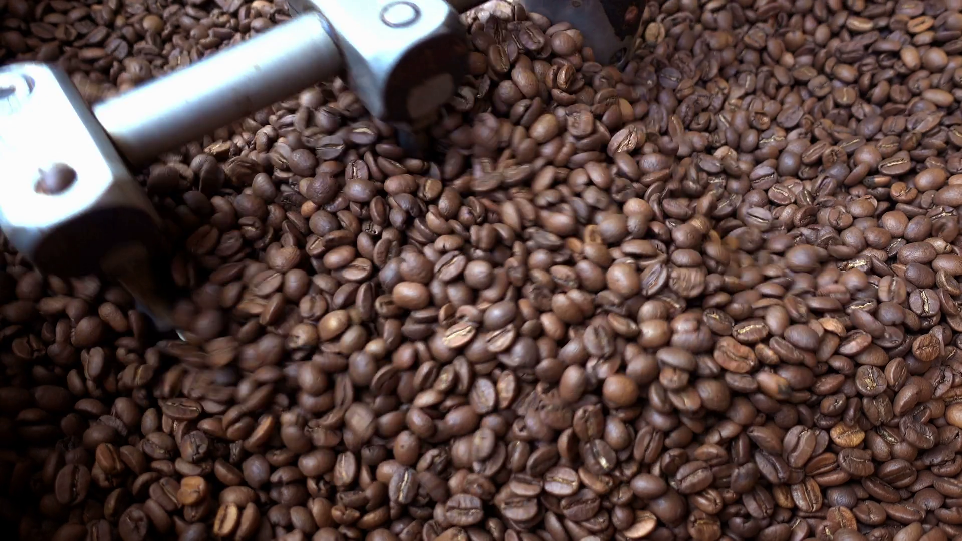 Mixing roasted coffee beans in roaster machine Stock Video Footage