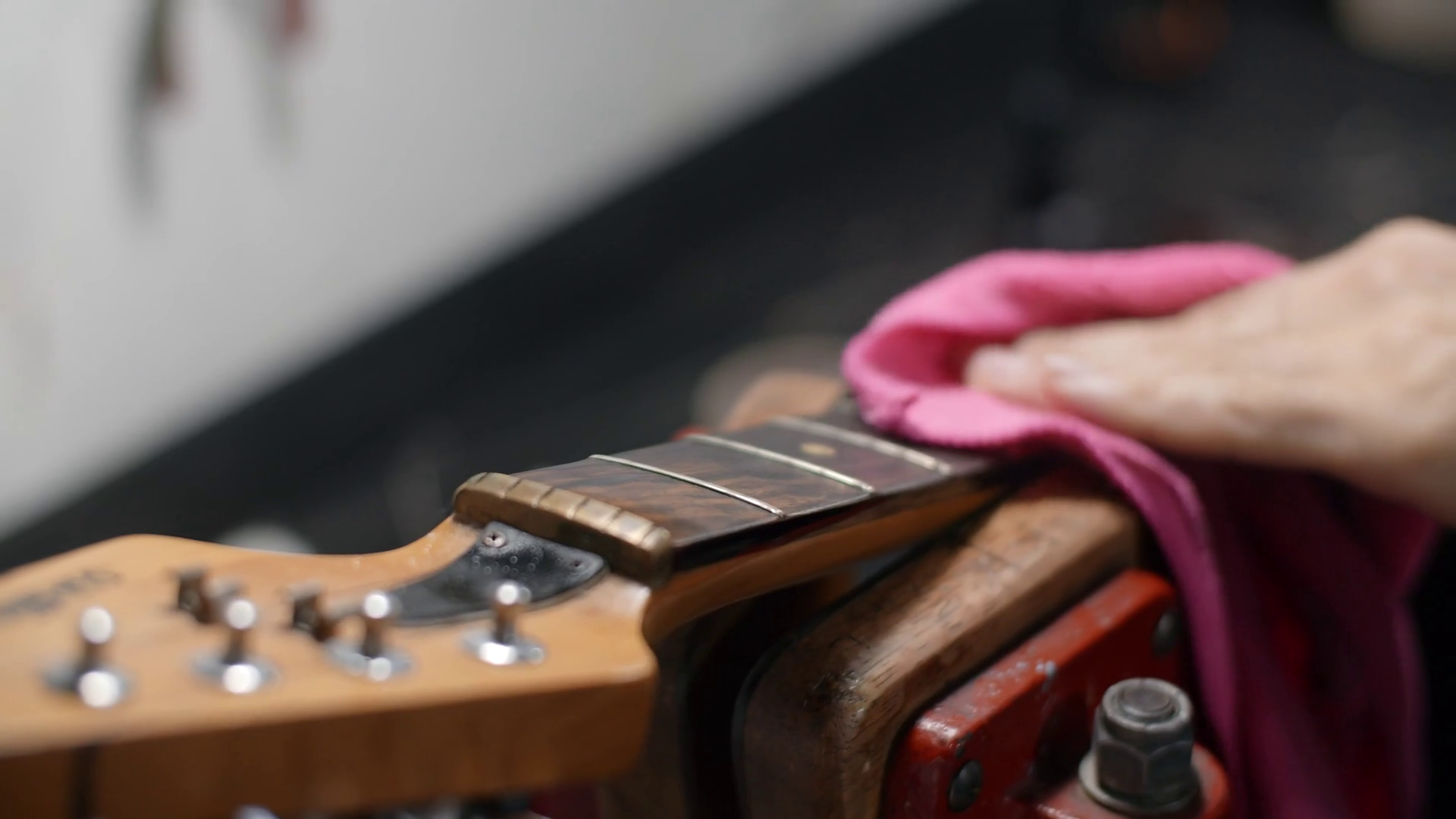 Guitar Tech Wipes Guitar Fretboard In Slow Stock Footage SBV346694874