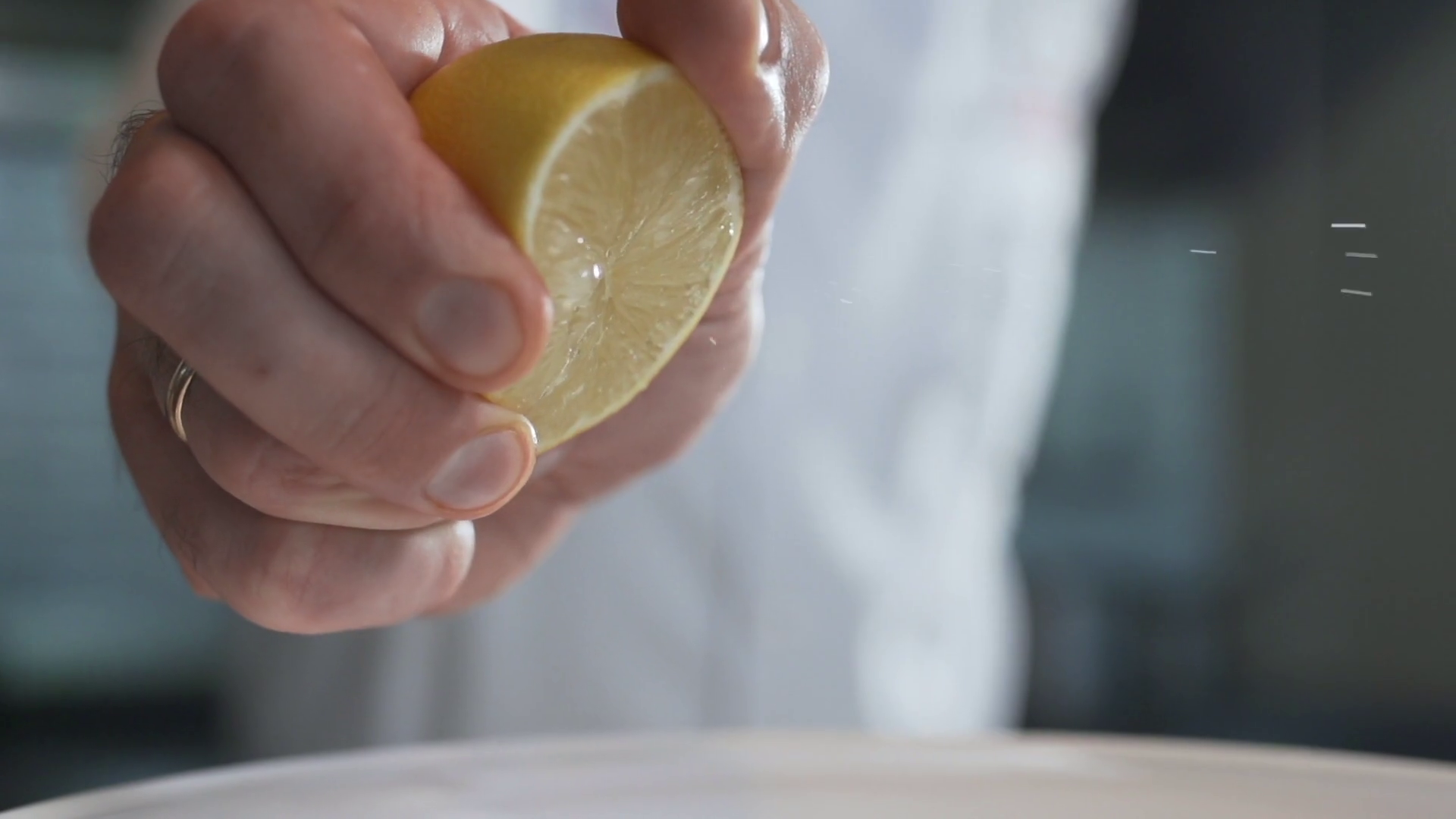 Chef Squeezes Out Lemon Juice In Slow Motion Stock Footage SBV