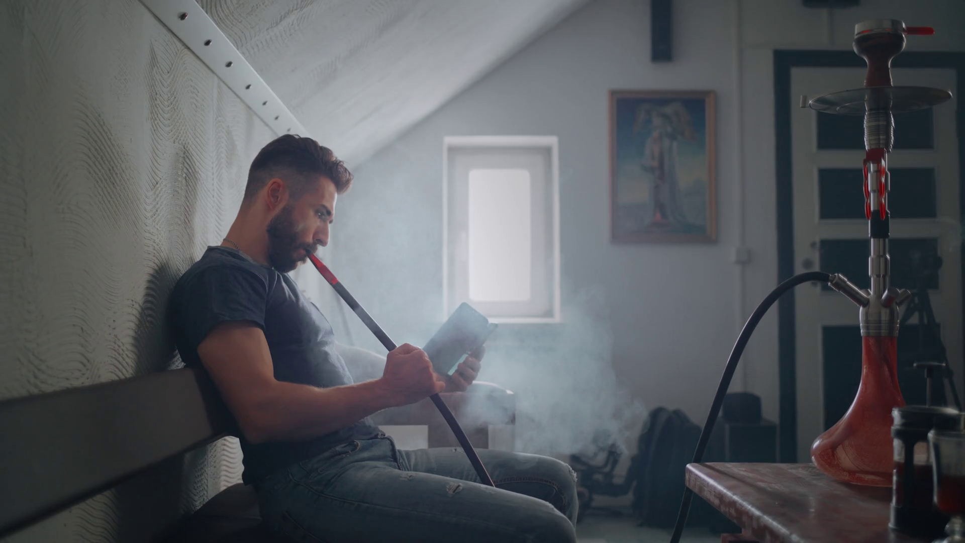 The Guy Smokes Hookah Indoors Exhales Smoke Stock Footage SBV338125511 Storyblocks