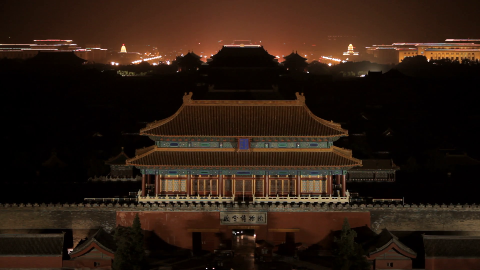 MS Chinese temple rooftop with city skyline in background at night