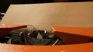 Typewriter close up, writer Typing on an old vintage antique typewriter - close up of hands on keys