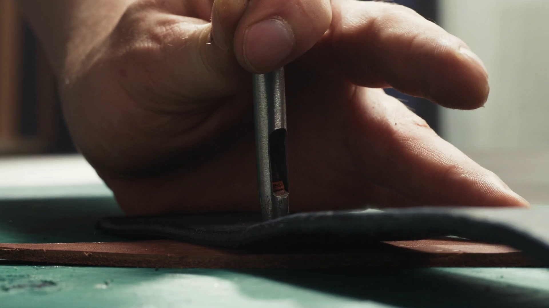 Man Hands Making Hole In Leather Belt With Stock Footage SBV346629696