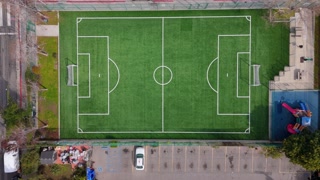 Drone Descent Over Soccer Field and Playground, Aerial 4K