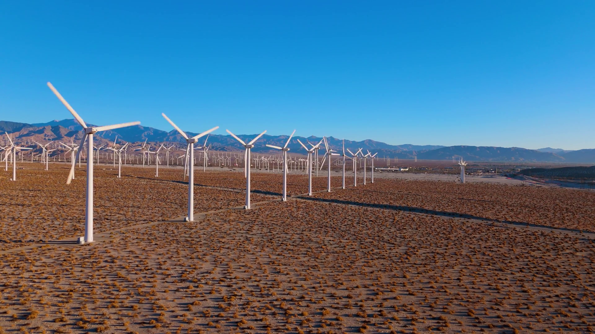 Side Aerial View Of Wind Turbine Row In Stock Footage SBV-352454405 ...