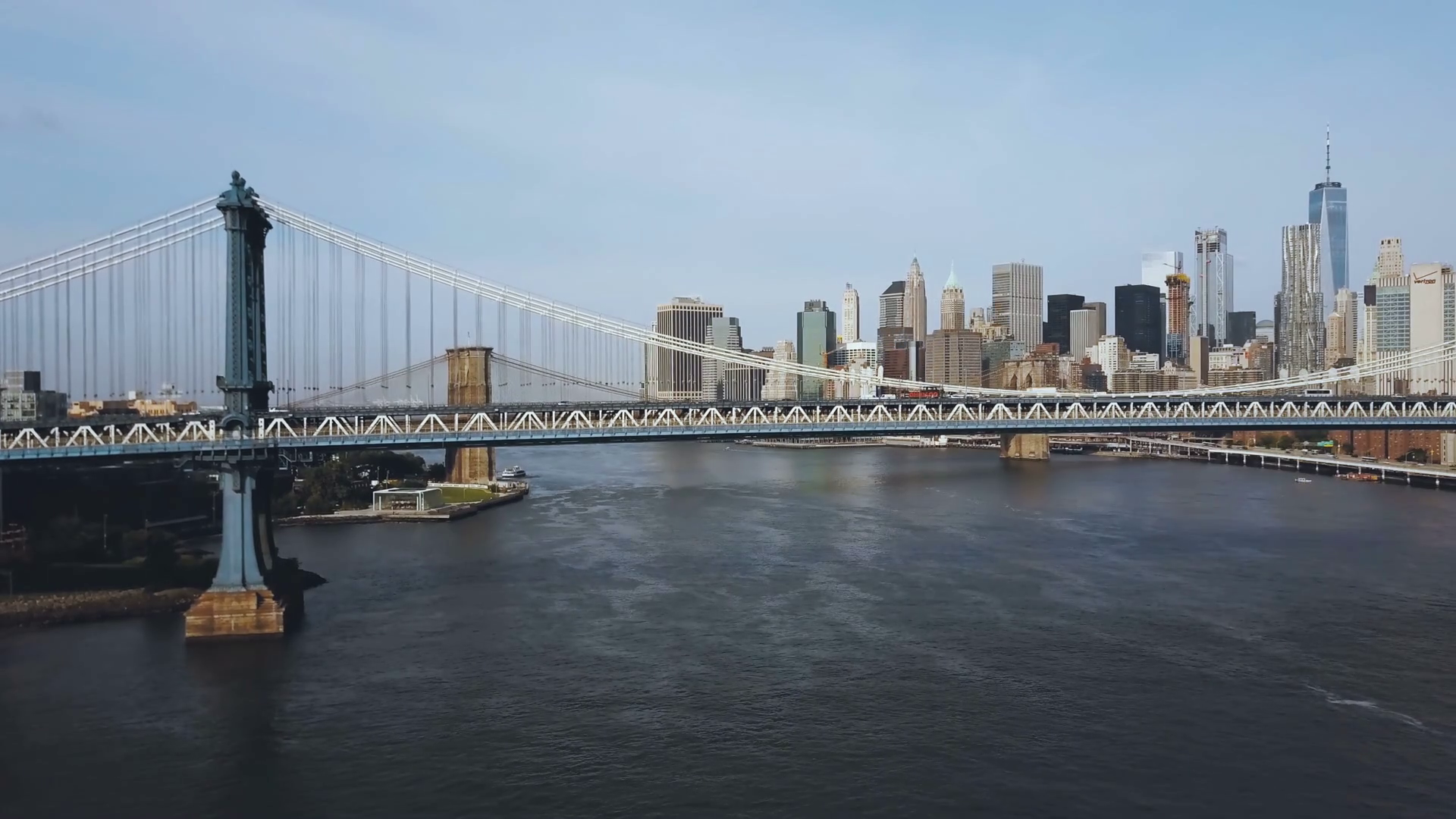 Aerial view of the Manhattan bridge through the East river. Drone