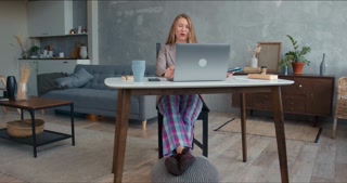 Work-from-home productivity tips: Young professional in comfy attire excels in virtual meetings