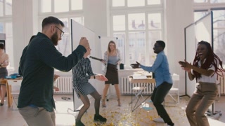Colleagues Celebrate Achievements at Office Party