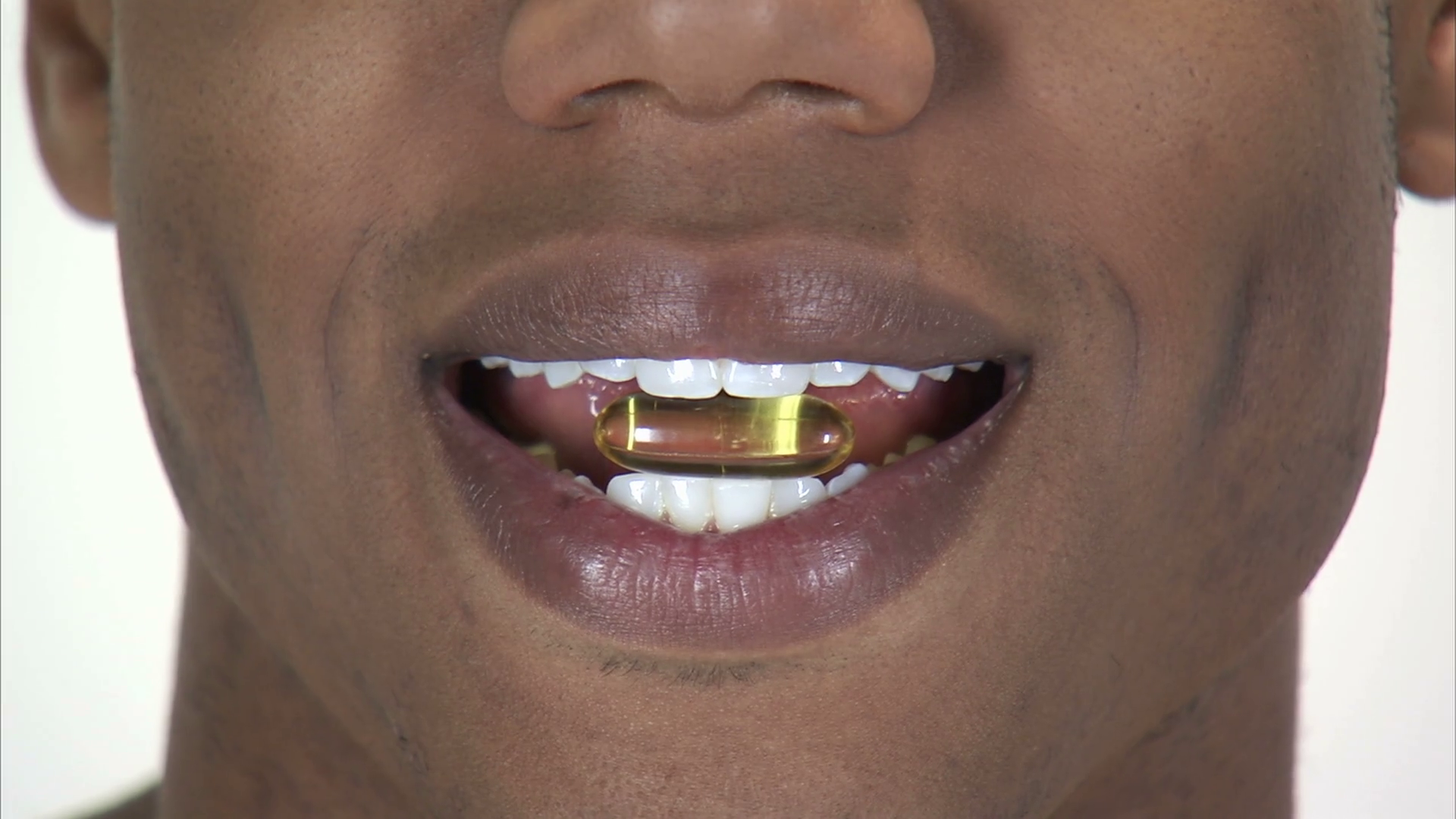 Black Man Holding Pill Between Teeth Stock Footage SBV300067738