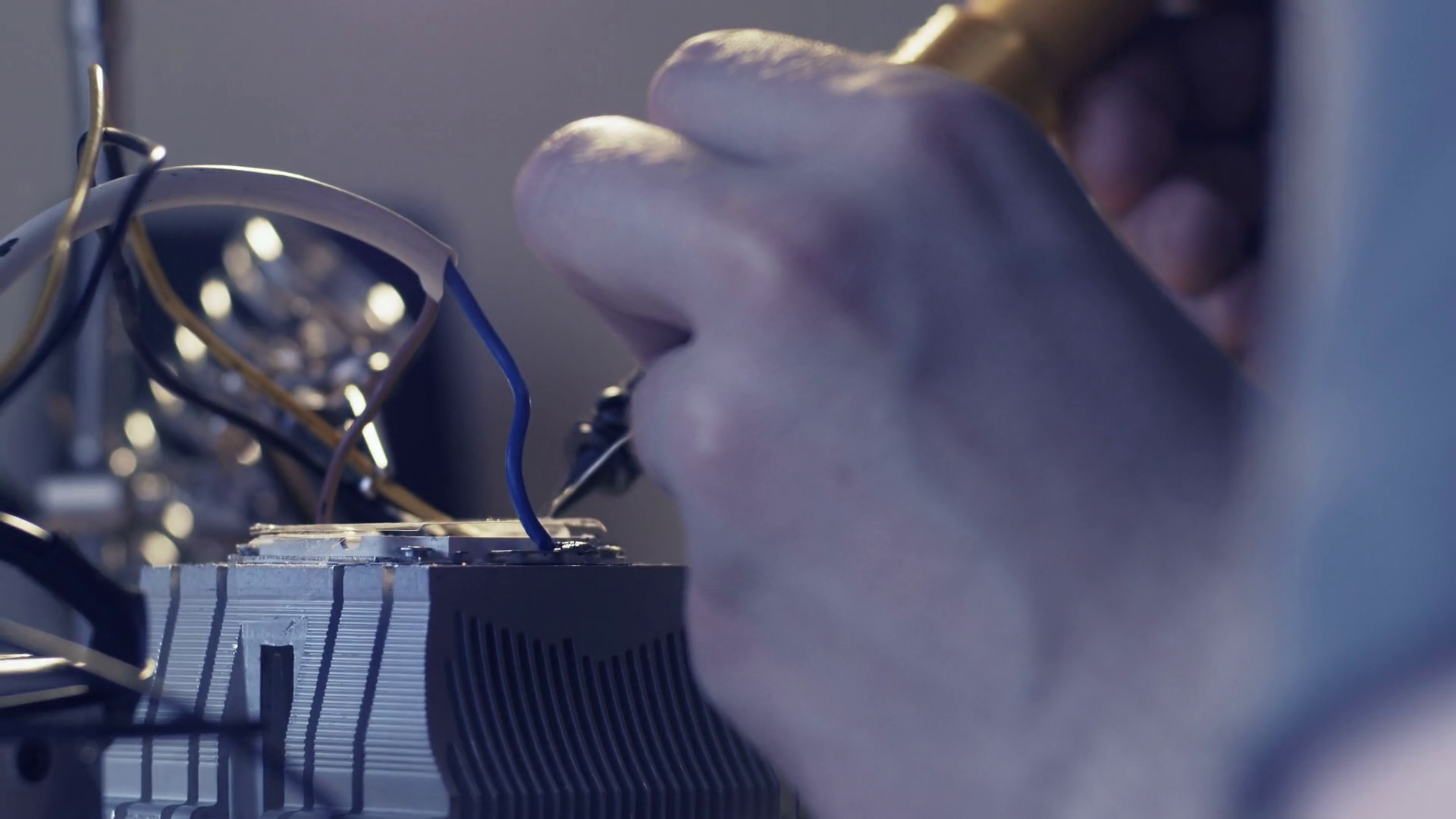 Close up Of Young Man Soldering Wires Man Constructing During His Free 