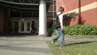 College Student Walking Into Library