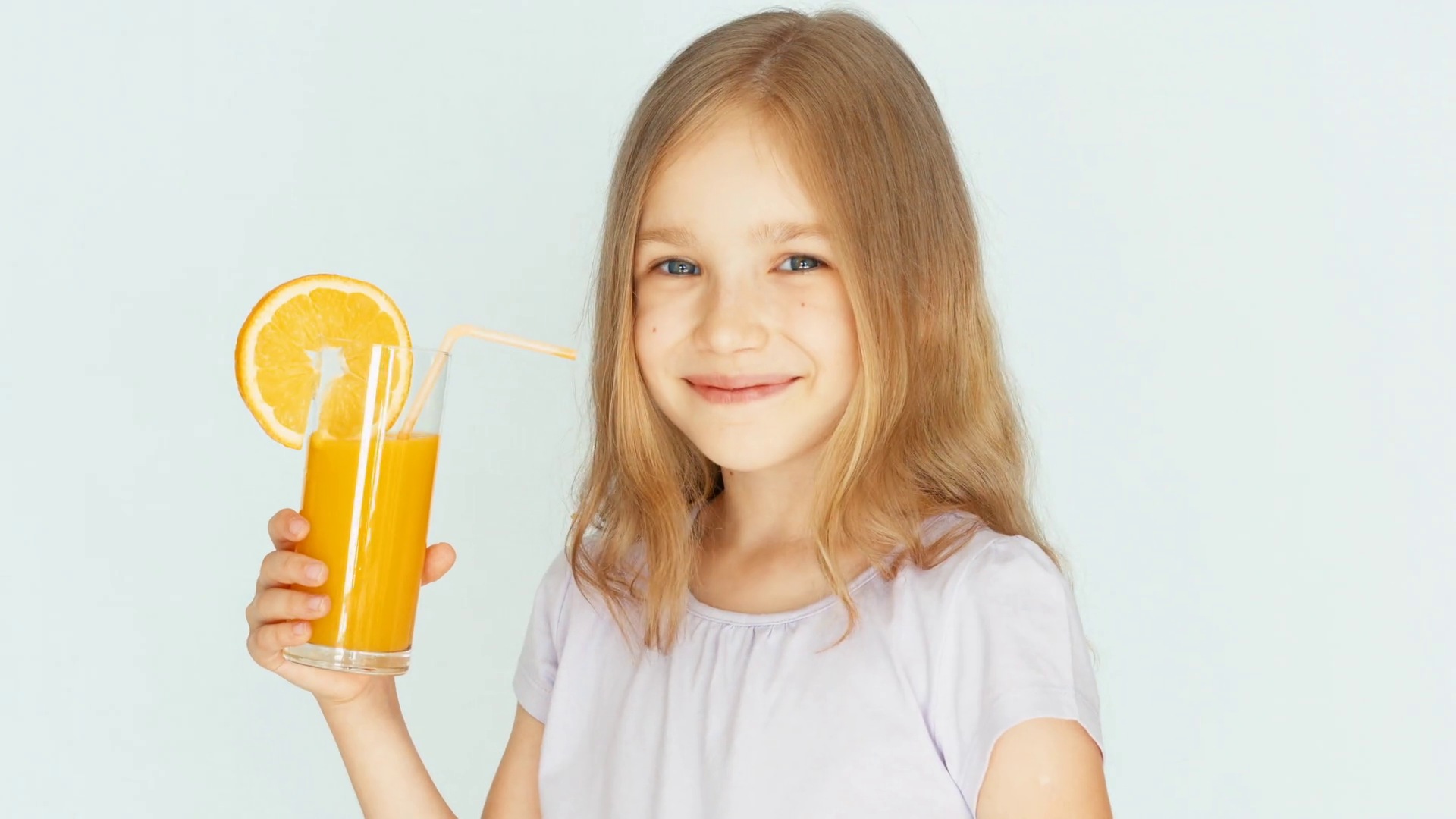 Girl Drinking Orange Juice Smiling At Camera Stock Footage SBV