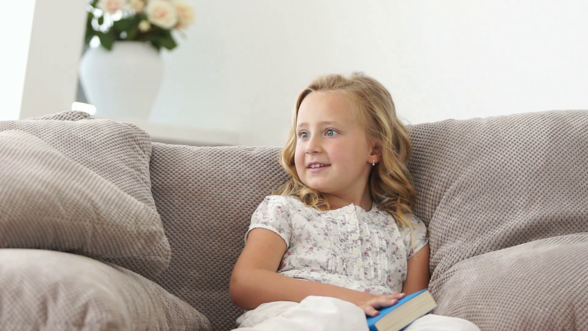 Girl Reading Book On Sofa Smiling Stock Footage SBV303960007 Storyblocks