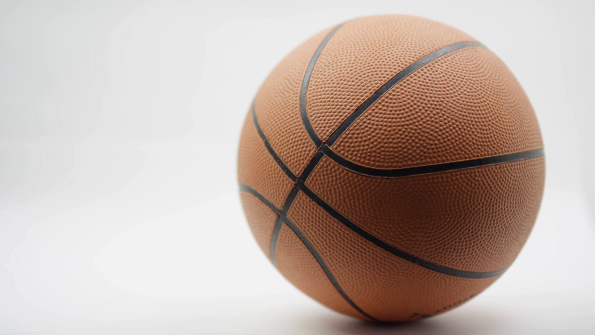 Macro Shot of Basketball on white background Stock Video Footage 0008