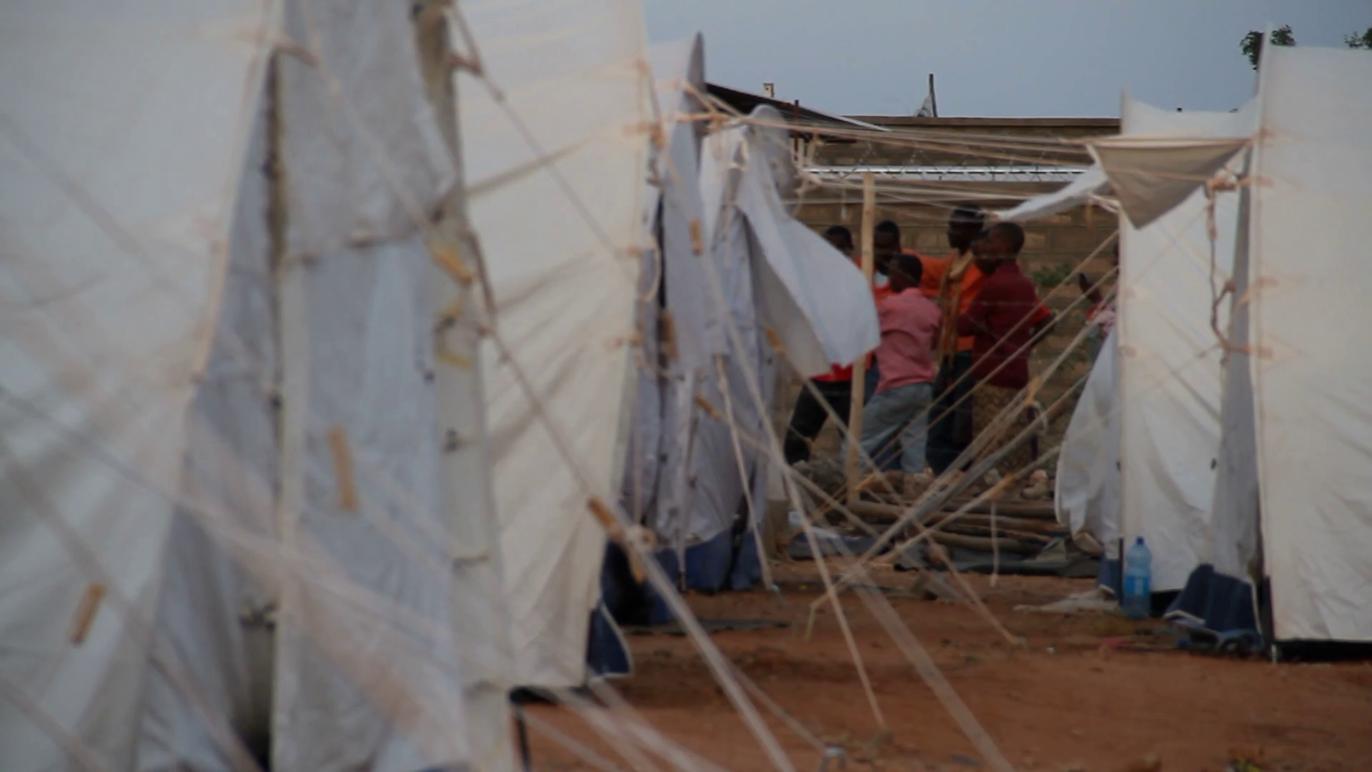 Men Talking Near Un Refugee Tents Stock Video Footage 0019 SBV