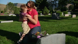 Mother And Son Visit Cemetery