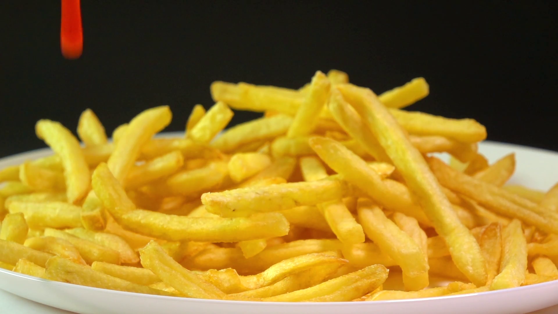 Pouring Tomato Sauce Over French Fries Stock Footage SBV310167777