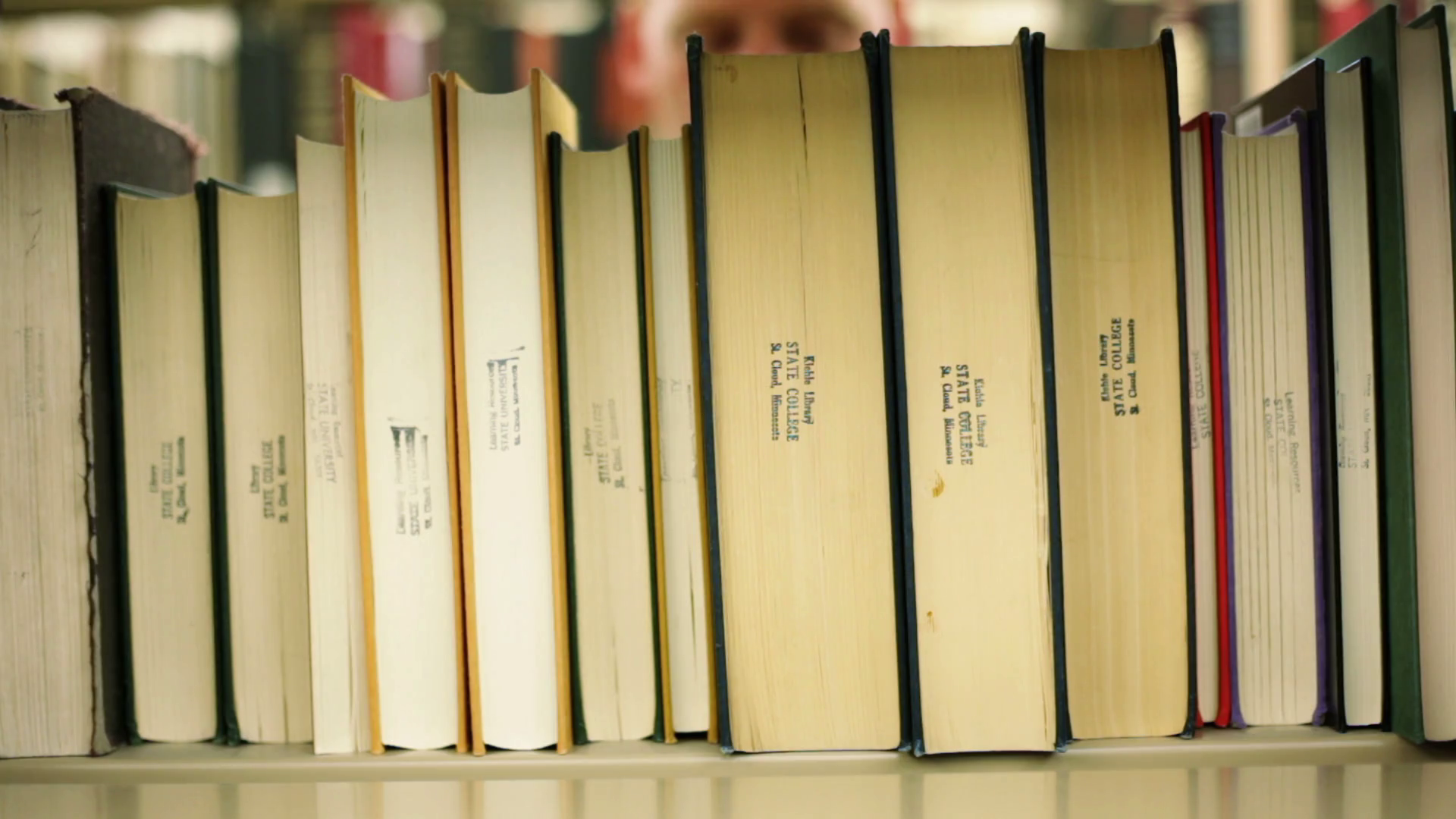 Reverse Angle Student Pulls Out Library Book Stock Footage SBV ...