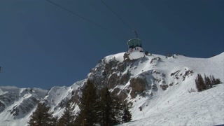 Shot Of Ski Gondola Rising Into A Blue Sky