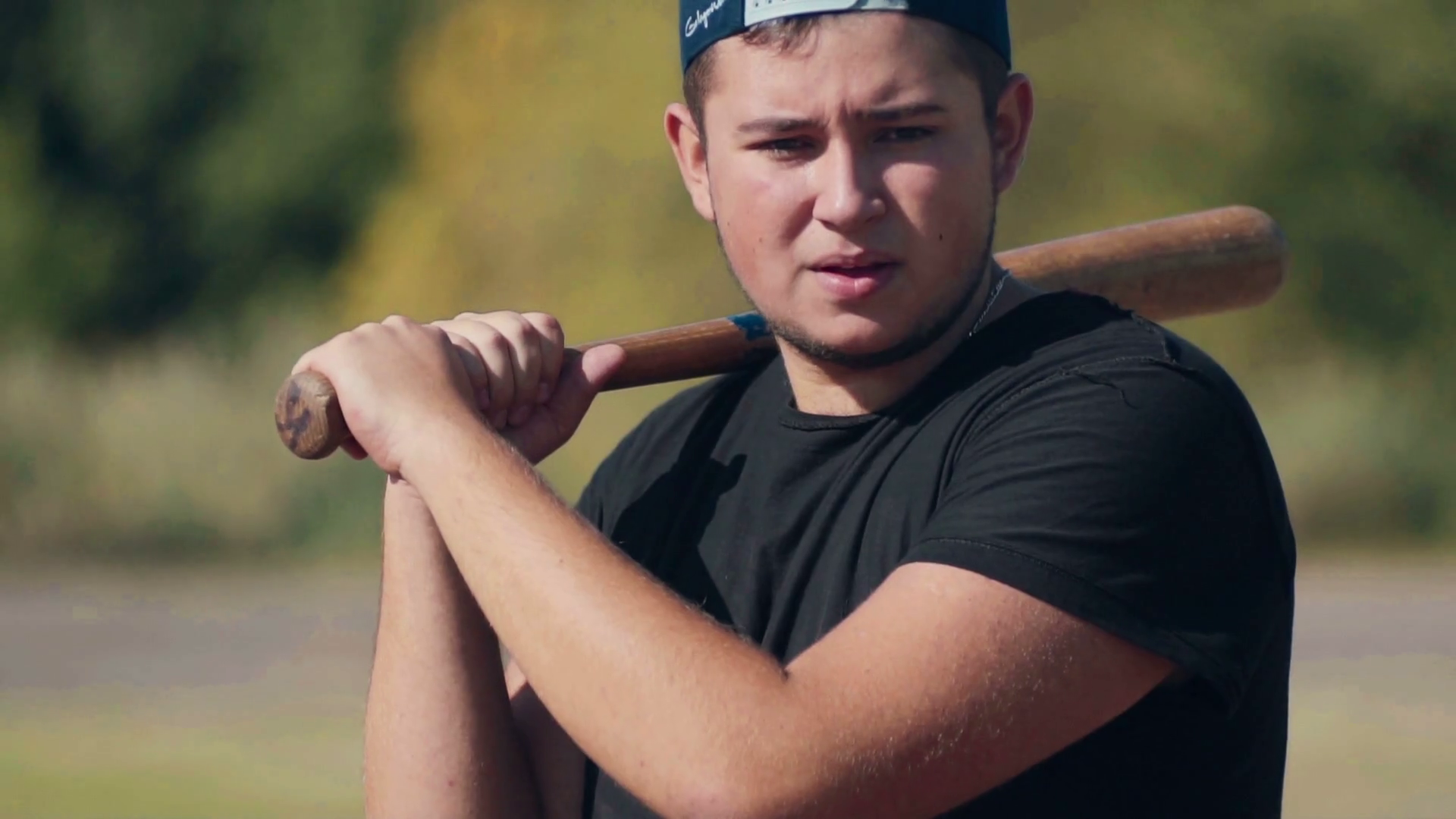 Slowmotion Young Male Batter Standing Ready for Pitch with Baseball Bat